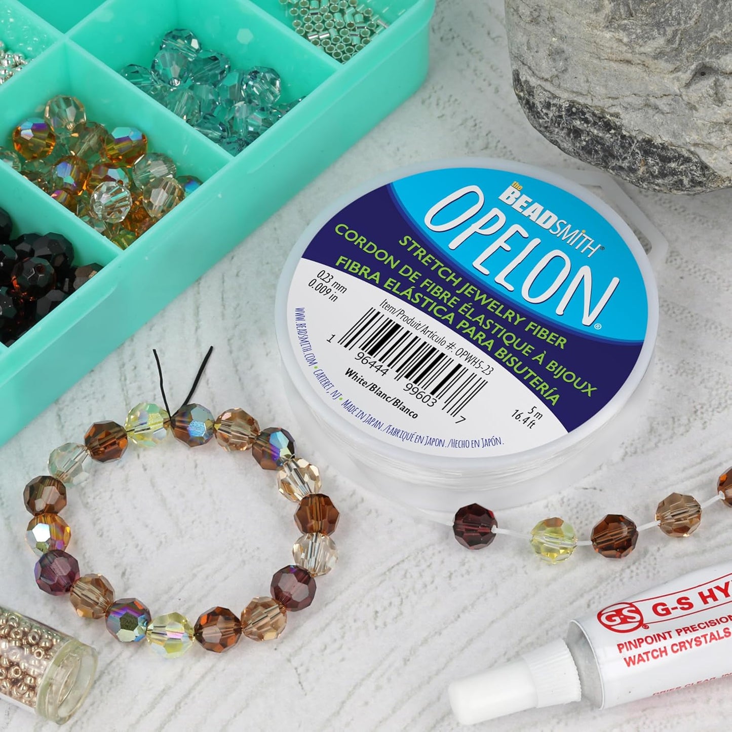 The Beadsmith Opelon Stretch Cord – Elastic Beading Fiber, White, 0.23 mm Diameter, 5 Meters (16.4 ft) Spool